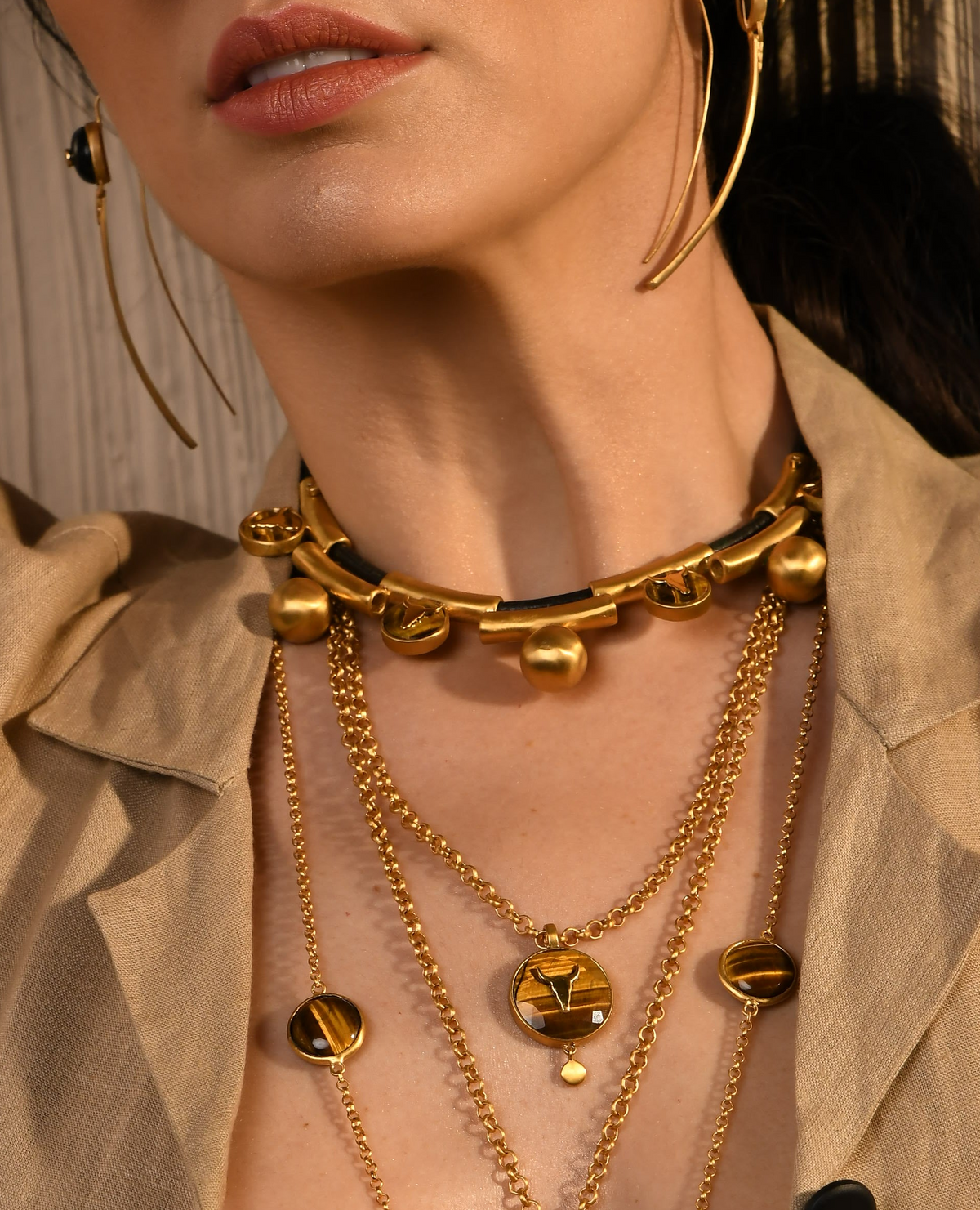 Close-up of a person wearing pendant with a natural background