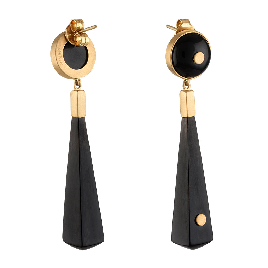 Pair of earrings with gold and white buffalo horn on a white background