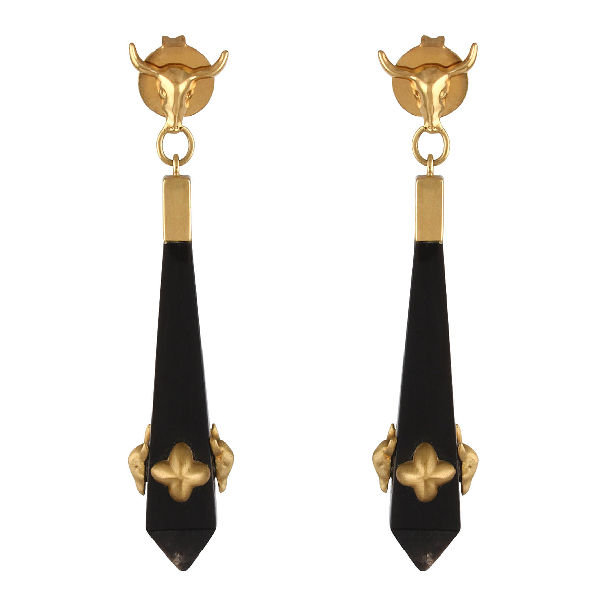 Pair of gold and black earrings on a white background