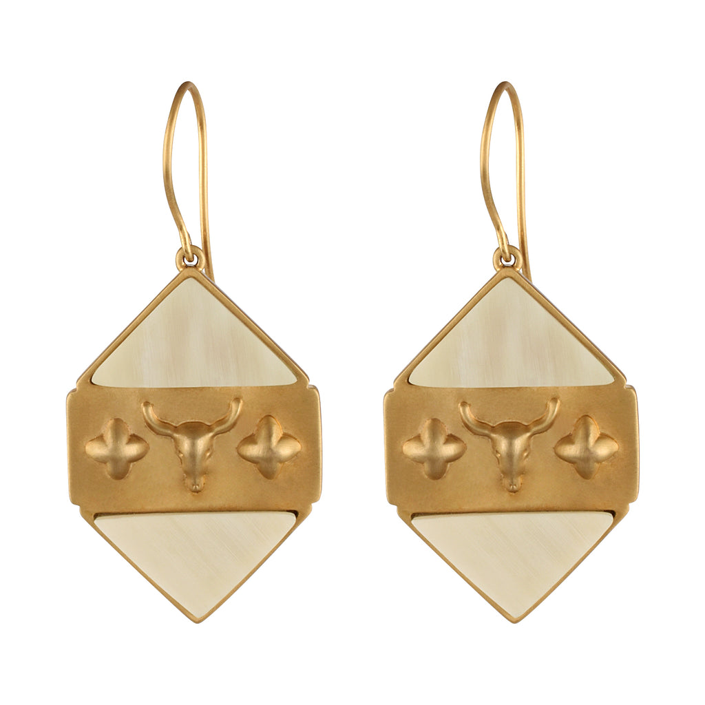 Gold and beige earrings with a buffalo head design on a white background