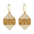 Gold and beige earrings with a buffalo head design on a white background