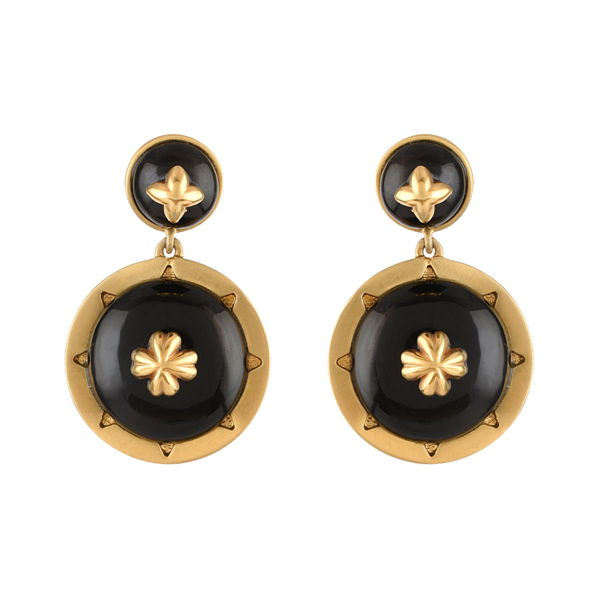 Pair of gold and black earrings on a white background
