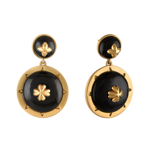 Pair of gold and black earrings on a white background