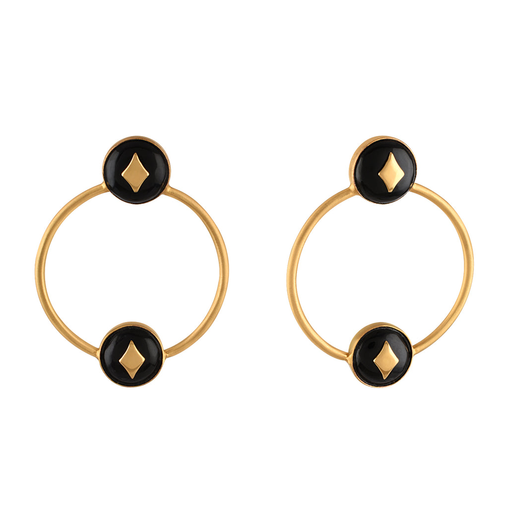 Pair of gold hoop earrings with black circular centers and gold accents on a white background