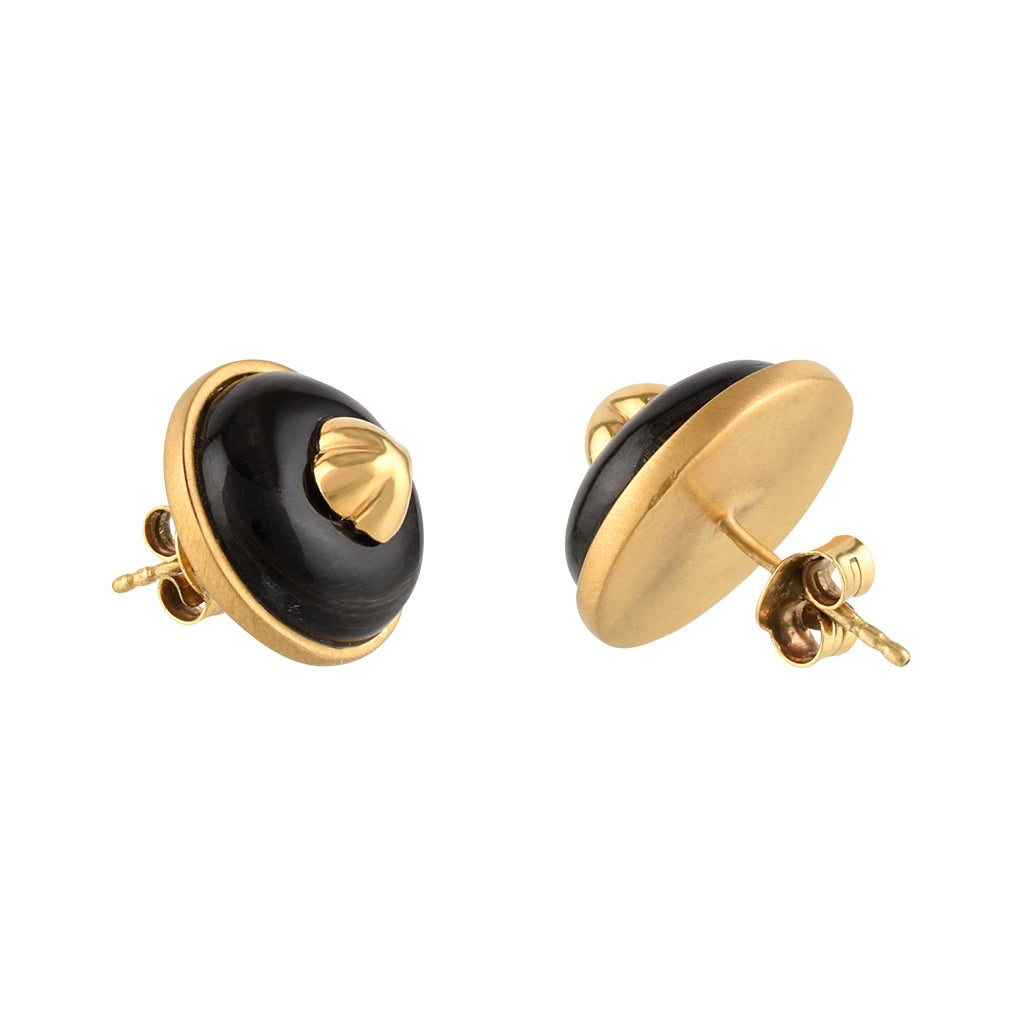Pair of gold and black earrings on a white background