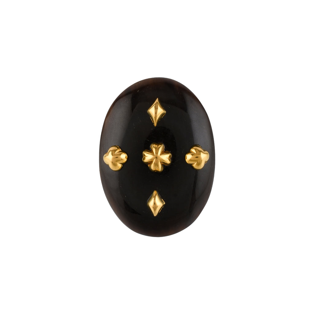 Black oval horn with gold geometric decorations on a white background