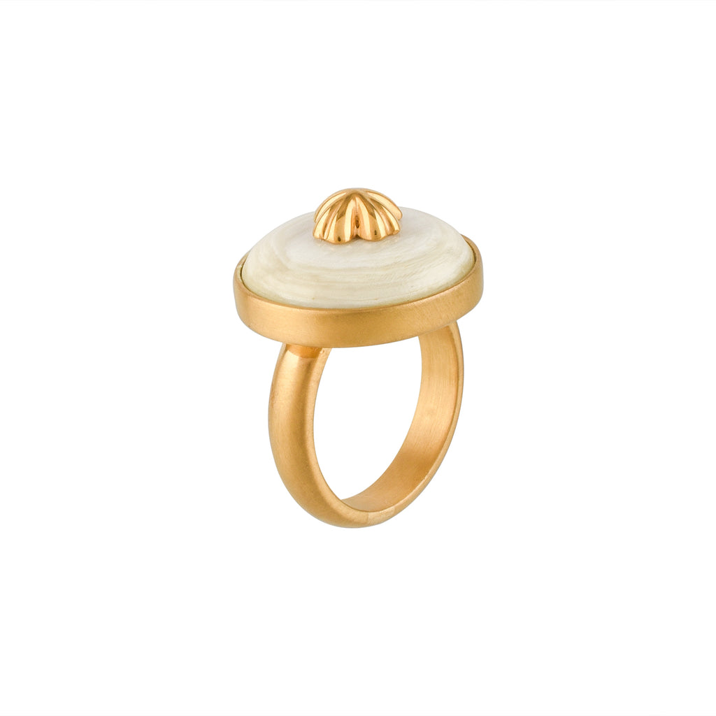 Gold ring with a white buffalo horn material and gold accent on a white background