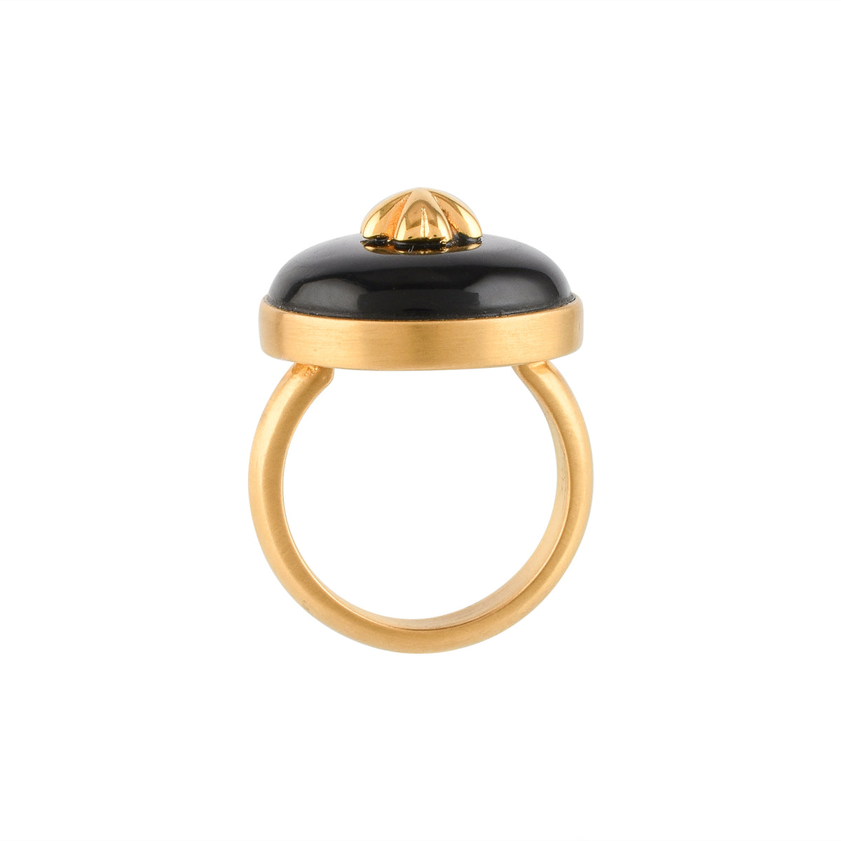 Gold ring with a black circular buffalo horn material and gold floral design on a white background