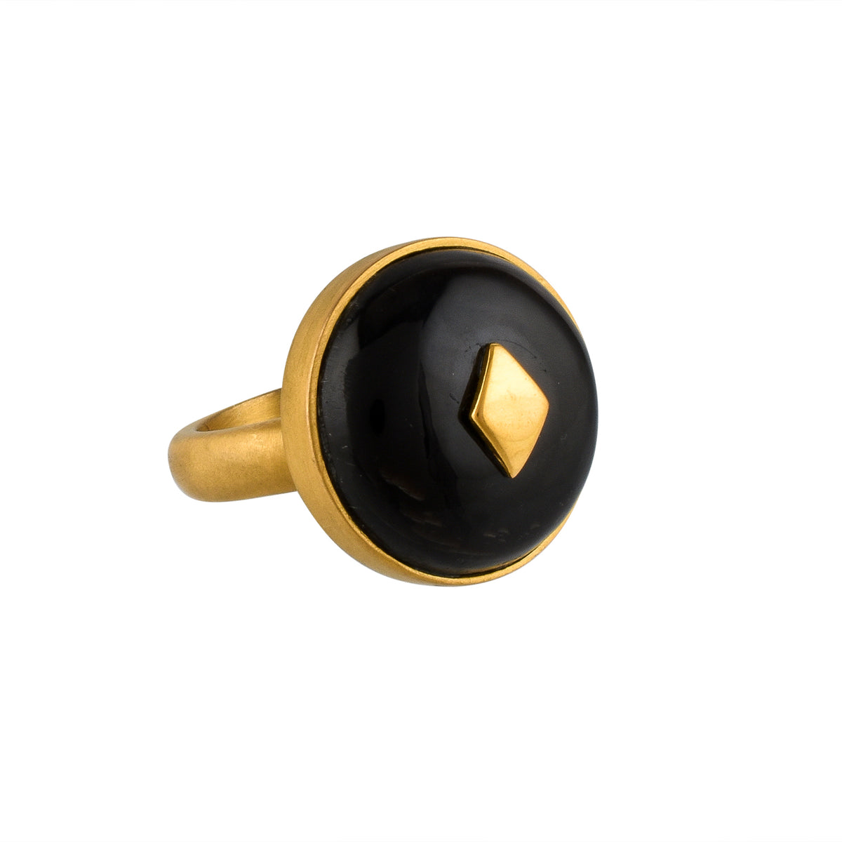 Gold ring with a black horn and gold accent on a white background