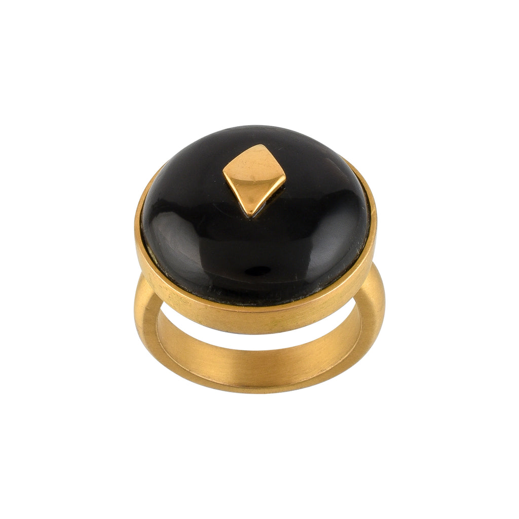 Gold ring with a black horn and gold accent on a white background
