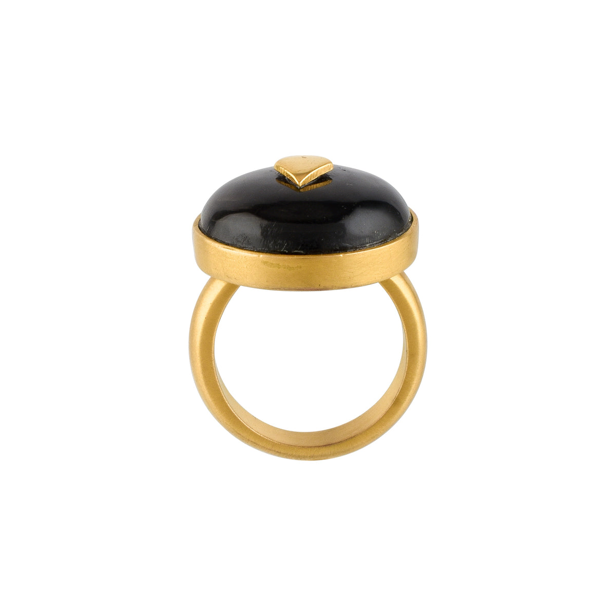 Gold ring with a black horn on a white background