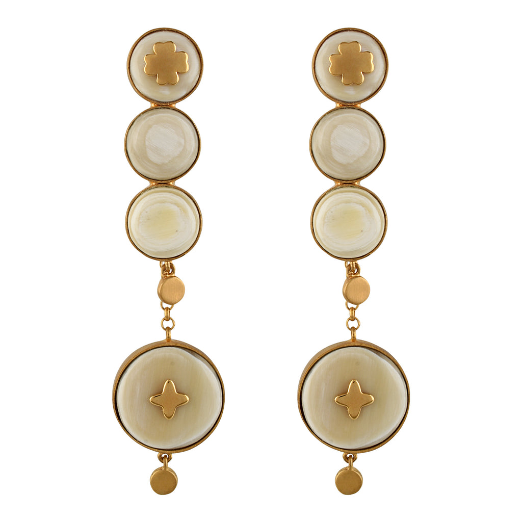 Pair of gold and white color earrings on a white background