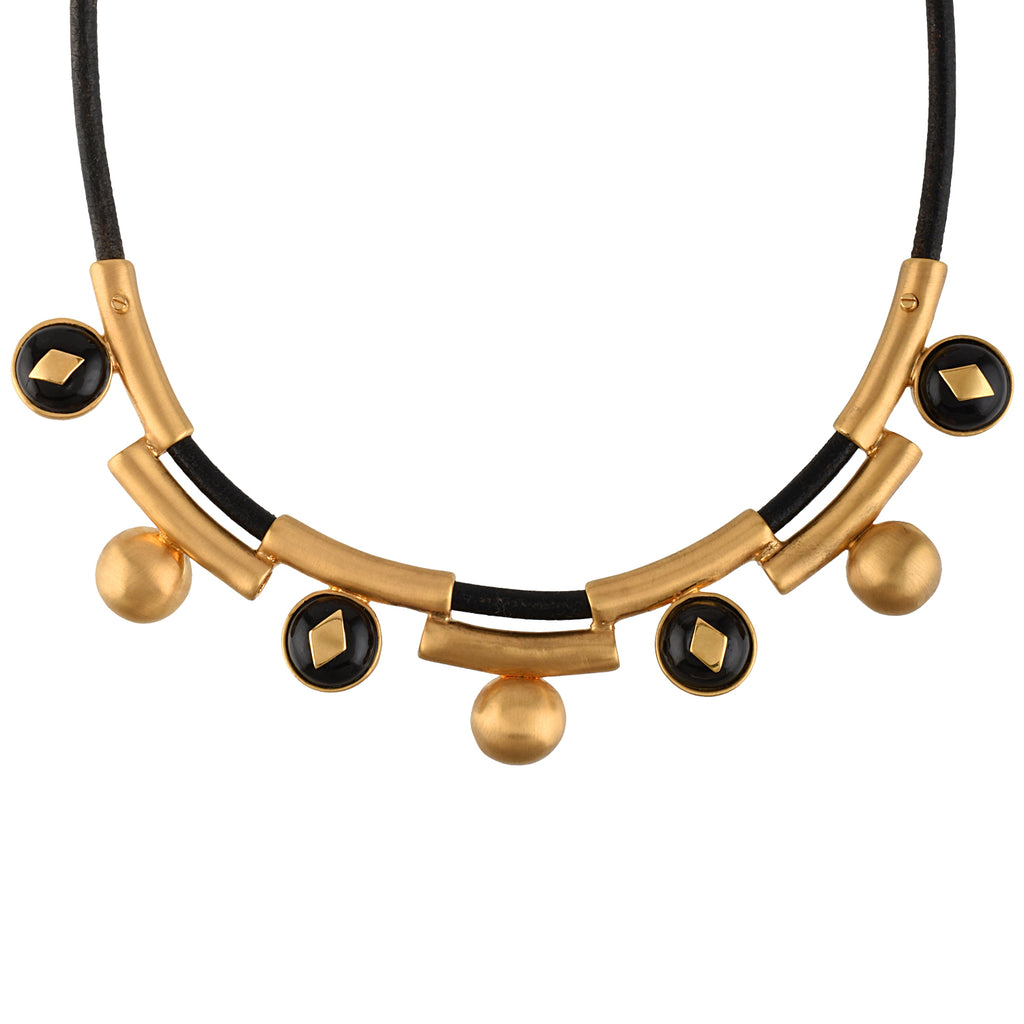 Gold and black necklace on a white background