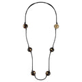 Necklace with black cord and buffalo horn beads on a white background