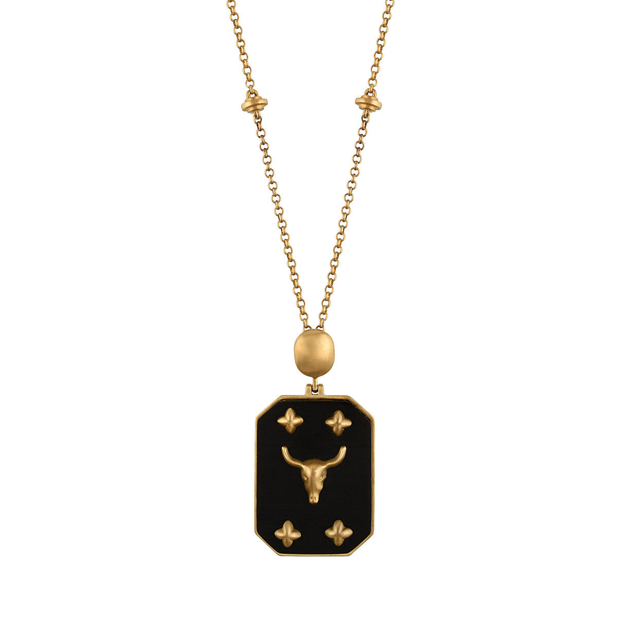 A gold necklace featuring a delicate chain with small star-like beads and a rectangular pendant with a bull symbol, displayed against a solid black background.
