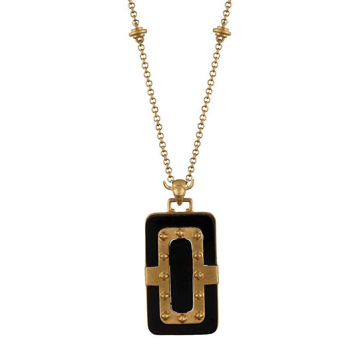 Gold necklace with a black pendant on a white background