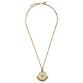 Gold chain with a pendant on a white background