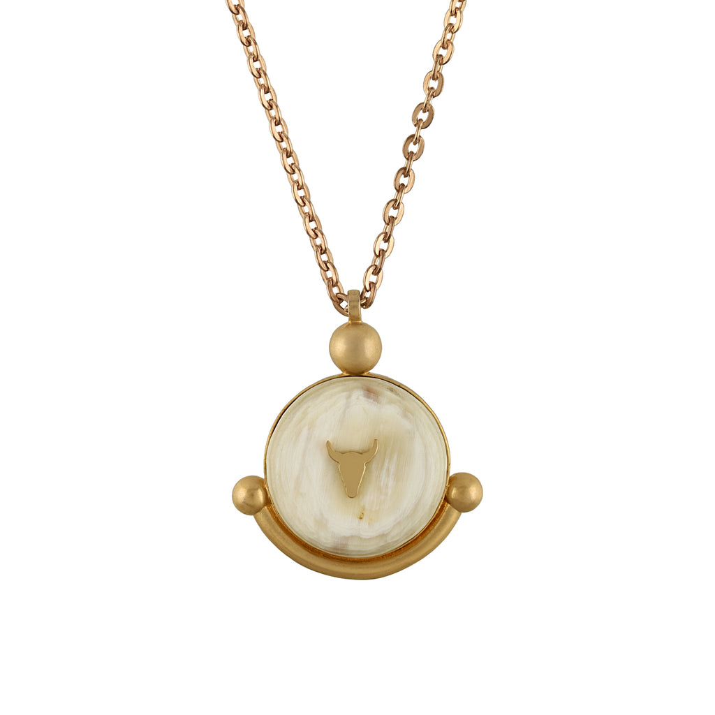 Gold chain with a circular pendant on a white background