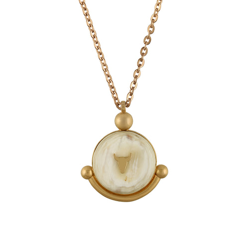 Gold chain with a circular pendant on a white background