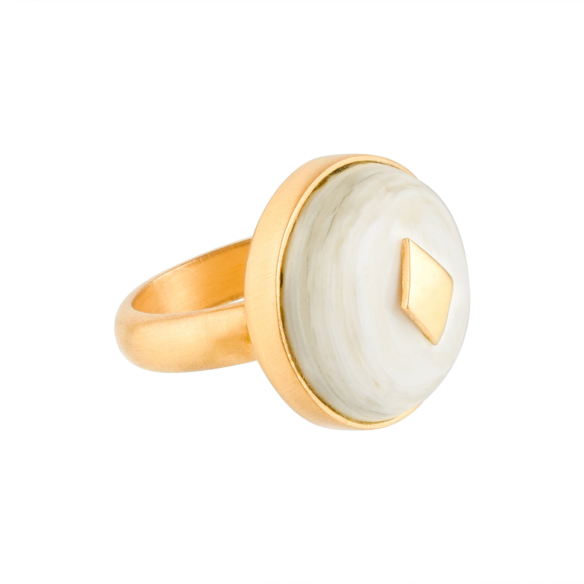 Gold ring with a white horn on a white background