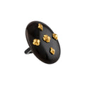 Black ring with gold accents on a white background